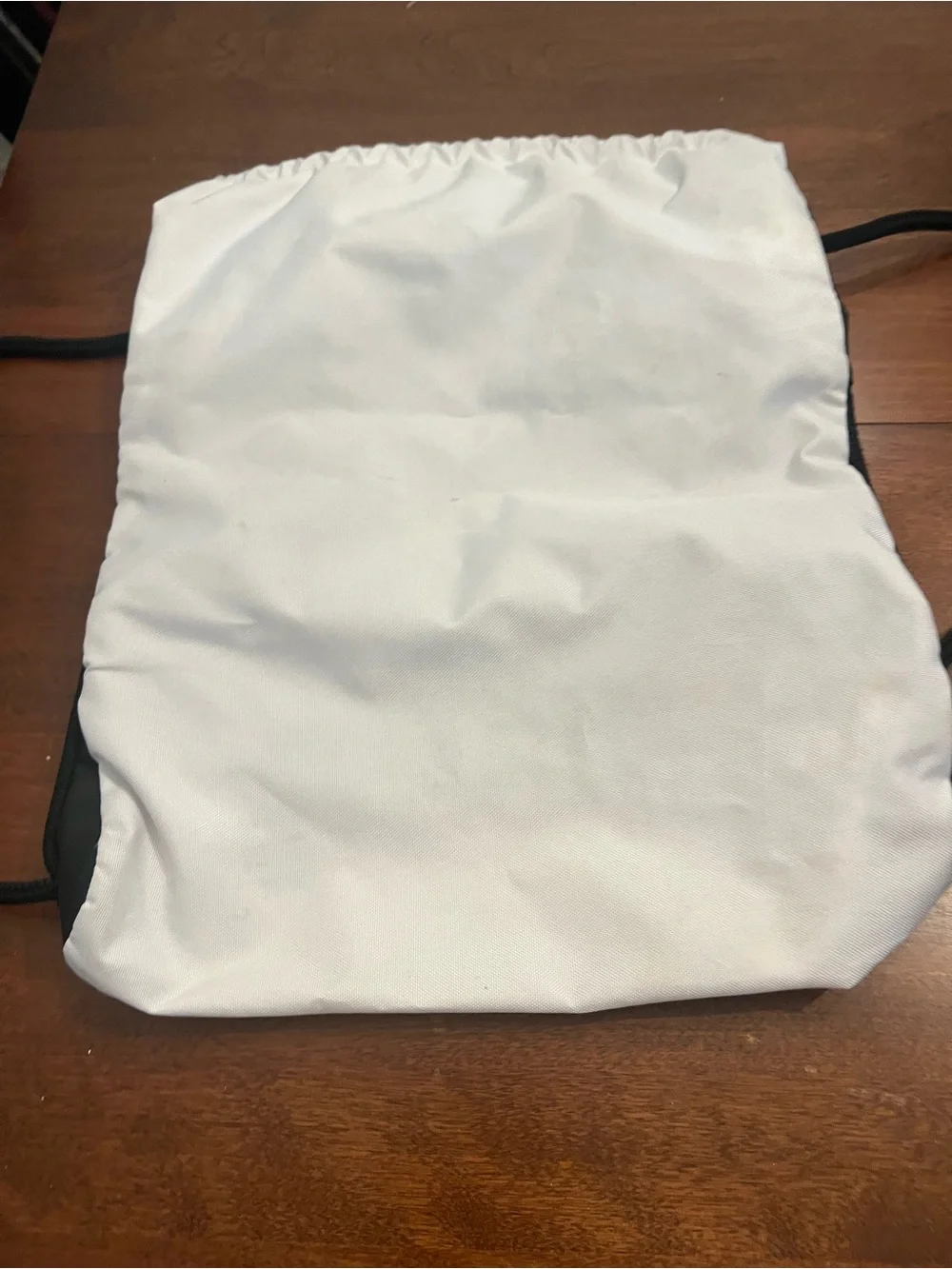 adidas White and Black Drawstring Backpack with Front Zip Pocket